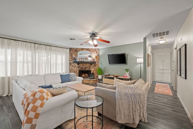 1218 Ridgeway Dr, Richardson, TX 75080 - living room featuring attic access, ceiling fan, dark wood-style flooring, and a stone fireplace