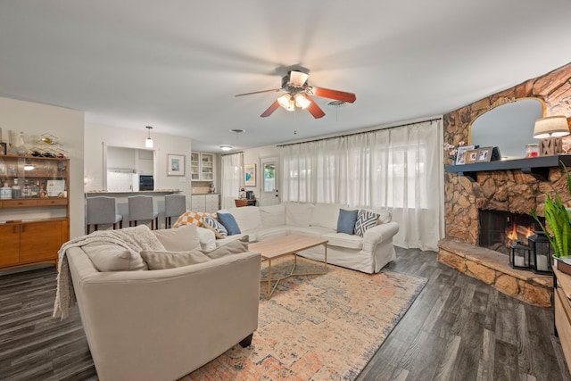 1218 Ridgeway Dr, Richardson, TX 75080 - living room with ceiling fan, dark wood-style floors, and a fireplace