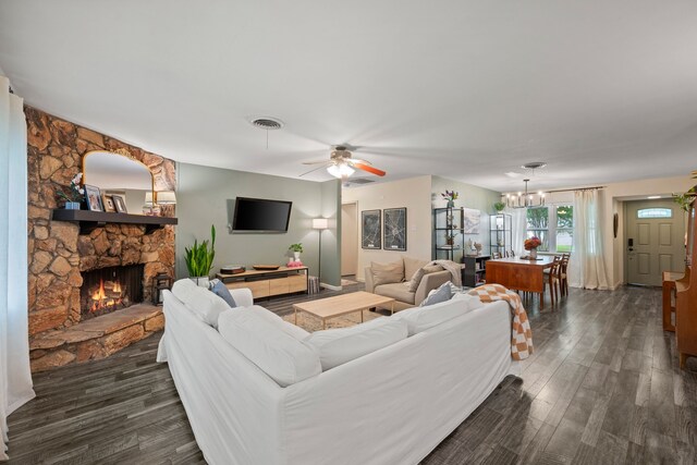 1218 Ridgeway Dr, Richardson, TX 75080 - living room featuring a fireplace, dark wood finished floors, a chandelier, and ceiling fan