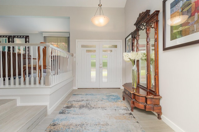 6141 Prestondell Ct, Dallas, TX 75240 - foyer entrance featuring french doors and wood finished floors