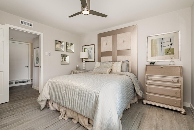 6141 Prestondell Ct, Dallas, TX 75240 - bedroom featuring light wood-style floors and a ceiling fan