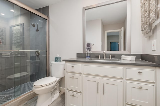 6141 Prestondell Ct, Dallas, TX 75240 - bathroom featuring vanity, a stall shower, and wood finished floors