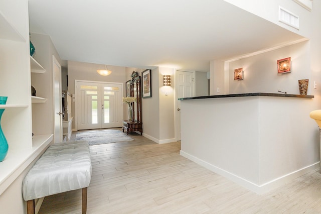 6141 Prestondell Ct, Dallas, TX 75240 - entryway with light wood-style flooring and french doors