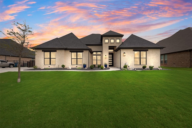 12480 Palmer Dr, Fort Worth, TX 76179 - view of front of house with brick siding, a front yard, and a shingled roof