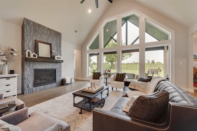 12480 Palmer Dr, Fort Worth, TX 76179 - living area featuring a ceiling fan, a fireplace, high vaulted ceiling, and wood finished floors