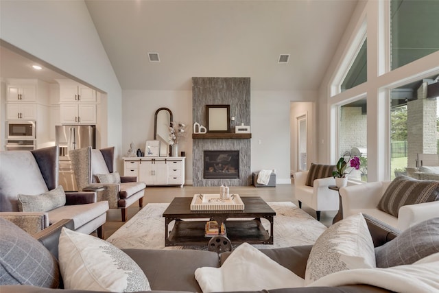 12480 Palmer Dr, Fort Worth, TX 76179 - living area with high vaulted ceiling, a large fireplace, recessed lighting, and wood finished floors