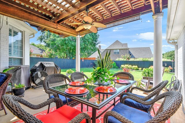 2310 Auburn Ct, Sherman, TX 75092 - fenced backyard with outdoor dining area, a ceiling fan, and grilling area