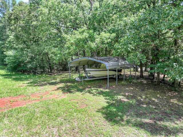 1605 County Road 1195, Yantis, TX 75497 - view of grassy yard with a carport