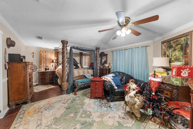 1605 County Road 1195, Yantis, TX 75497 - bedroom featuring wood finished floors, ornamental molding, a textured ceiling, and ceiling fan