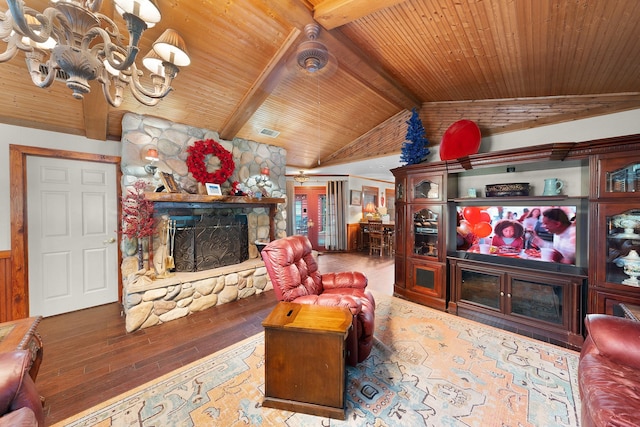 1605 County Road 1195, Yantis, TX 75497 - living room with a fireplace, wooden ceiling, wood-type flooring, and a chandelier