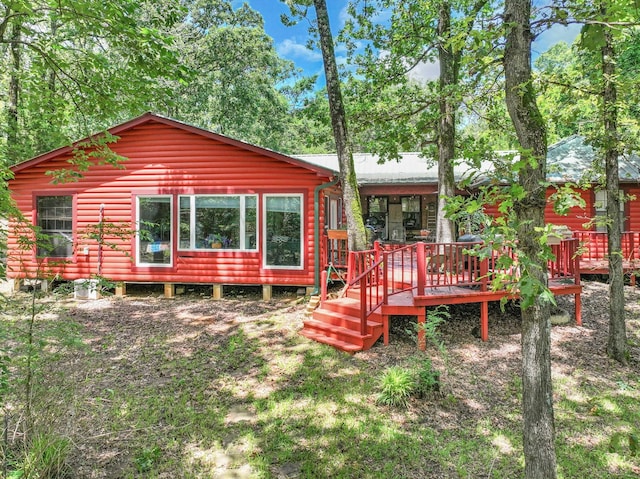 1605 County Road 1195, Yantis, TX 75497 - rear view of property featuring a deck and faux log siding