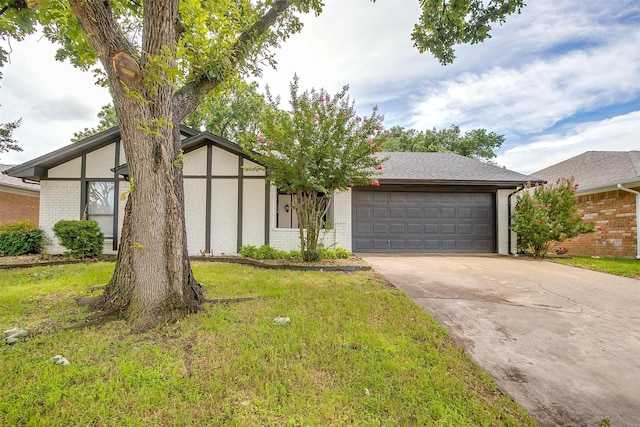 3925 Singleleaf Ln, Fort Worth, TX 76133 - view of front facade with an attached garage, brick siding, concrete driveway, and a front lawn