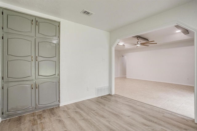 3925 Singleleaf Ln, Fort Worth, TX 76133 - unfurnished room with arched walkways, light wood-type flooring, and ceiling fan