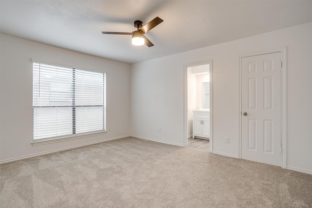 3925 Singleleaf Ln, Fort Worth, TX 76133 - unfurnished bedroom featuring light colored carpet, ensuite bath, and a ceiling fan