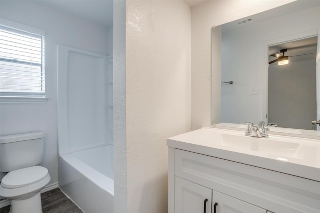 3925 Singleleaf Ln, Fort Worth, TX 76133 - full bath with vanity, wood finished floors, shower / washtub combination, and a textured wall