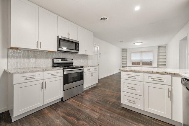 2250 Capri Dr, Fort Worth, TX 76114 - kitchen with stainless steel appliances, dark wood-style flooring, tasteful backsplash, and white cabinetry