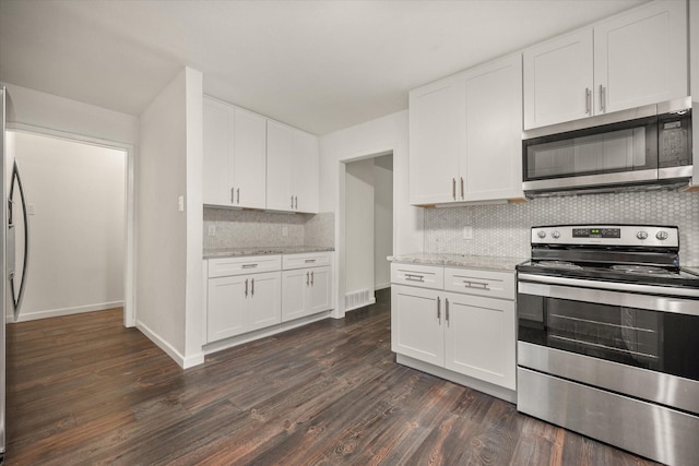2250 Capri Dr, Fort Worth, TX 76114 - kitchen featuring stainless steel appliances, backsplash, dark wood-style flooring, and white cabinetry