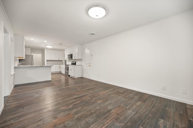 2250 Capri Dr, Fort Worth, TX 76114 - unfurnished living room featuring dark wood finished floors, recessed lighting, and crown molding