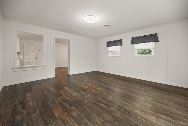 2250 Capri Dr, Fort Worth, TX 76114 - spare room featuring dark wood-style flooring and baseboards