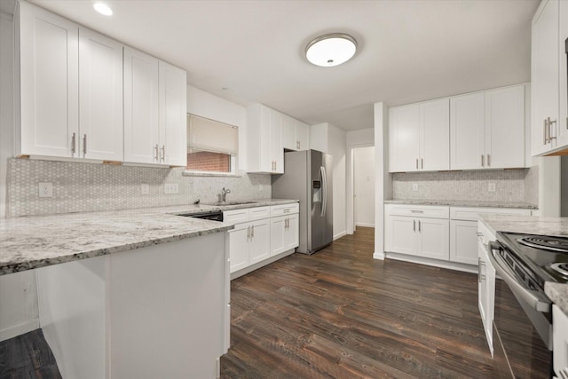 2250 Capri Dr, Fort Worth, TX 76114 - kitchen with stainless steel appliances, decorative backsplash, light stone countertops, white cabinets, and recessed lighting