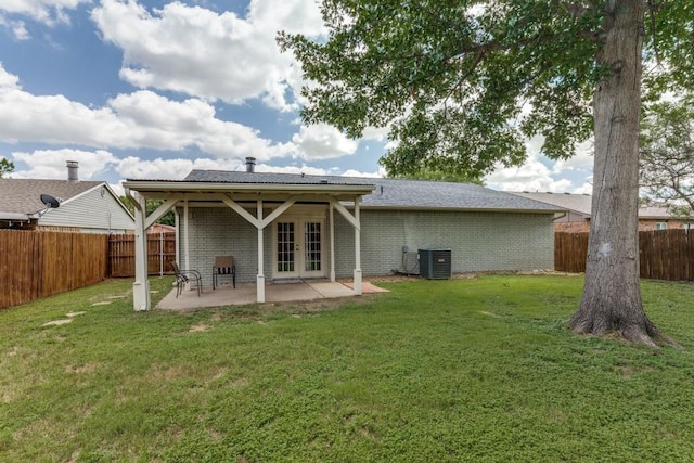 4113 Blue Flag Ln, Fort Worth, TX 76137 - back of house featuring french doors, a patio, a fenced backyard, and brick siding
