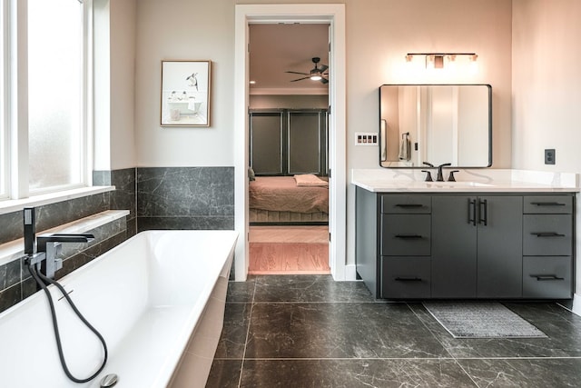 8500 Fresh Meadows Rd, North Richland Hills, TX 76182 - bathroom with vanity, a ceiling fan, a bath, marble finish floors, and crown molding
