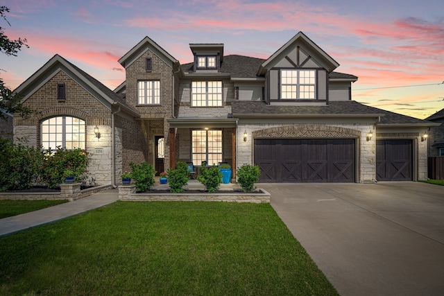 1251 Castle Dr, Prosper, TX 75078 - view of front of property with a yard, driveway, and stone siding