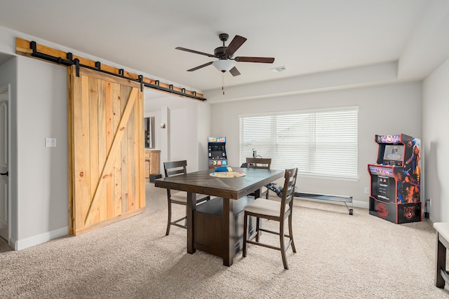 1251 Castle Dr, Prosper, TX 75078 - carpeted dining area featuring ceiling fan and a barn door