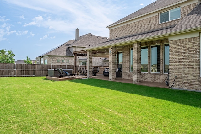 1251 Castle Dr, Prosper, TX 75078 - back of house featuring brick siding, a patio, a shingled roof, and a chimney