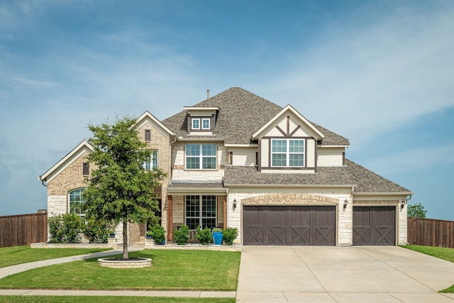 1251 Castle Dr, Prosper, TX 75078 - view of front of home with driveway, a shingled roof, and stone siding