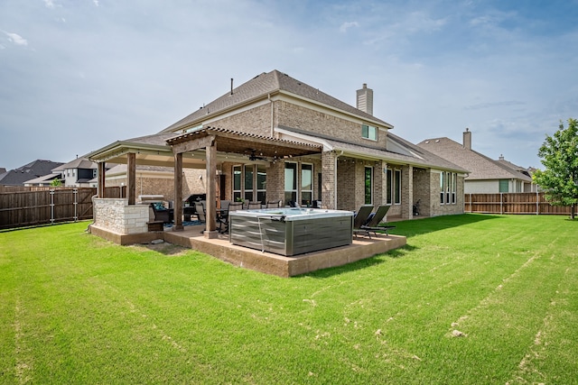 1251 Castle Dr, Prosper, TX 75078 - rear view of house featuring a fenced backyard, brick siding, a hot tub, a patio area, and a chimney