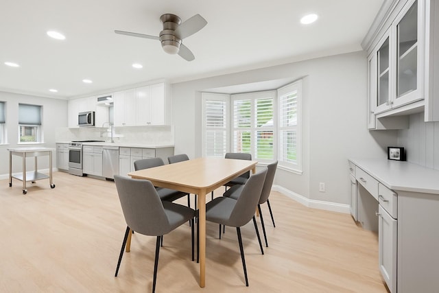 1301 Warwick St, Garland, TX 75040 - dining area with light wood-style flooring, ceiling fan, and recessed lighting
