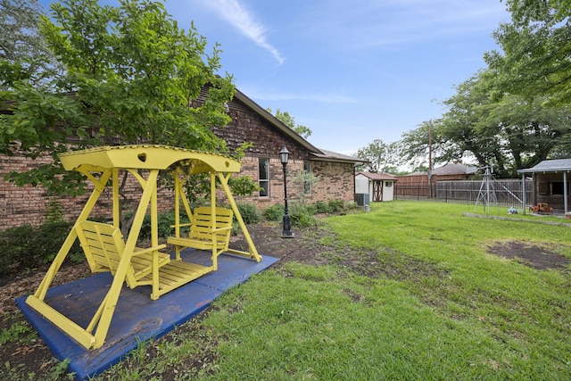 1301 Warwick St, Garland, TX 75040 - view of yard featuring a shed and a playground