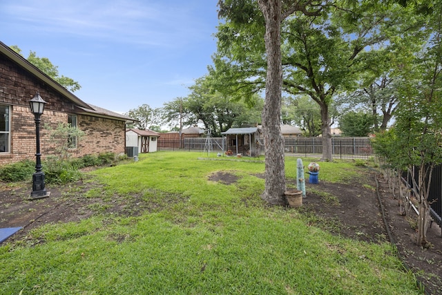 1301 Warwick St, Garland, TX 75040 - fenced backyard with an outdoor structure
