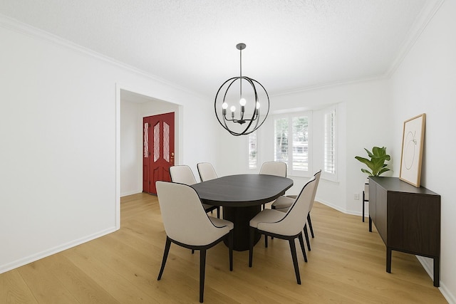 1301 Warwick St, Garland, TX 75040 - dining space featuring a chandelier, crown molding, and light wood finished floors
