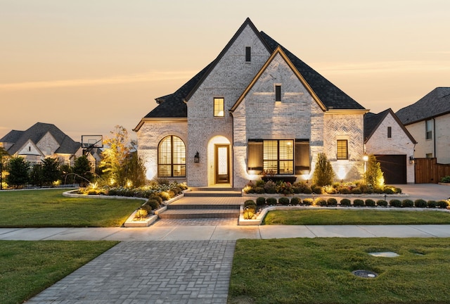 3791 Marble Hill Rd, Frisco, TX 75034 - french country inspired facade with brick siding, a lawn, and driveway