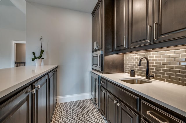 3791 Marble Hill Rd, Frisco, TX 75034 - kitchen with tasteful backsplash, dark brown cabinets, light countertops, light floors, and stainless steel microwave