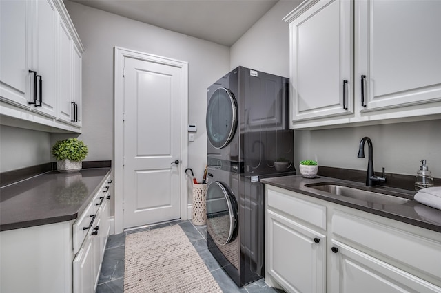 3791 Marble Hill Rd, Frisco, TX 75034 - laundry area featuring estacked washer and dryer and cabinet space