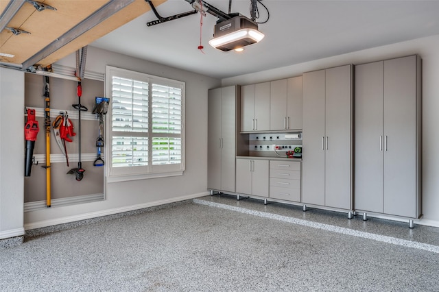 3791 Marble Hill Rd, Frisco, TX 75034 - garage featuring a garage door opener and baseboards