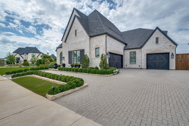 3791 Marble Hill Rd, Frisco, TX 75034 - french country style house with decorative driveway, a garage, and a gate