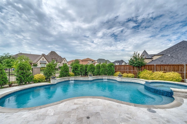 3791 Marble Hill Rd, Frisco, TX 75034 - view of swimming pool featuring a fenced backyard, a pool with connected hot tub, and a residential view