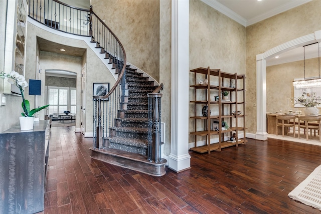 1641 Crockett Dr, Frisco, TX 75033 - staircase featuring a high ceiling, wood finished floors, and crown molding