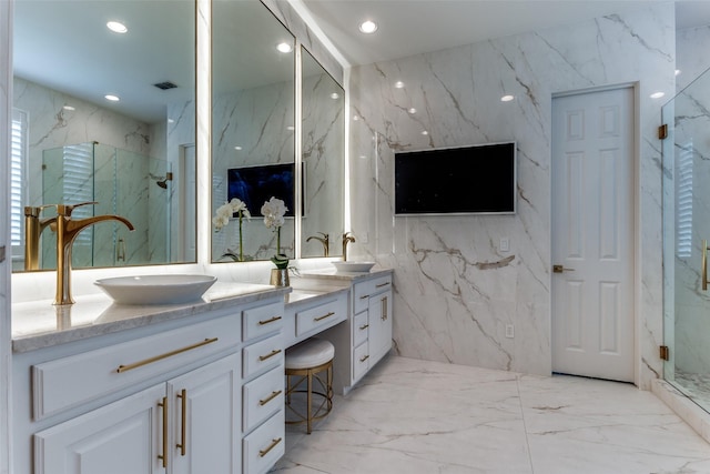 1641 Crockett Dr, Frisco, TX 75033 - full bath with stone wall, tile walls, marble tiled floors, double vanity, and a marble finish shower