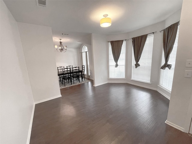 1622 Hightimber Ln, Wylie, TX 75098 - spare room featuring plenty of natural light, a chandelier, and dark wood-type flooring
