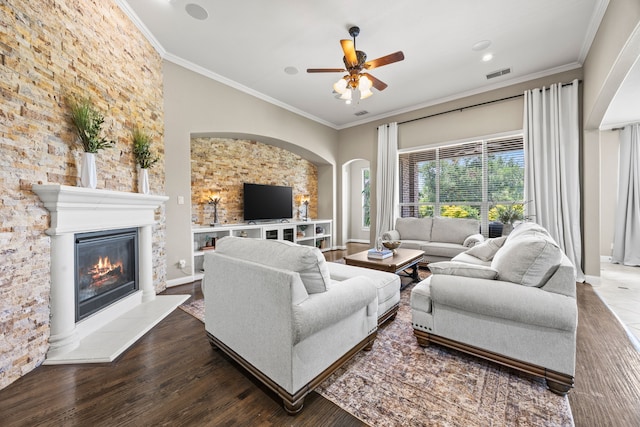 881 Derick Ln, Prosper, TX 75078 - living area featuring wood finished floors, a glass covered fireplace, crown molding, ceiling fan, and recessed lighting