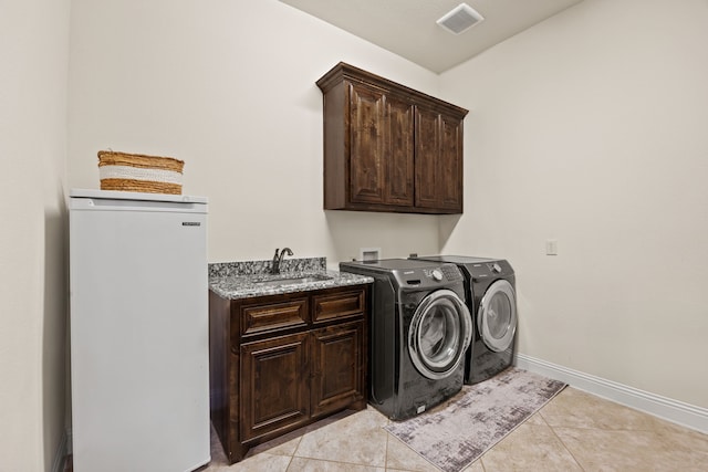 881 Derick Ln, Prosper, TX 75078 - washroom featuring cabinet space, separate washer and dryer, and light tile patterned flooring