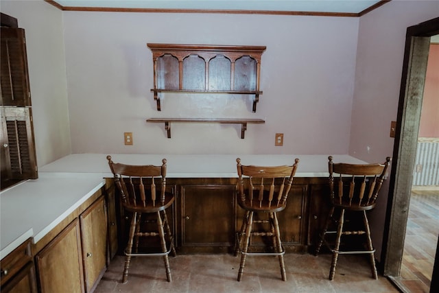 130 Golfcrest St, Rusk, TX 75785 - dining room featuring bar area and ornamental molding