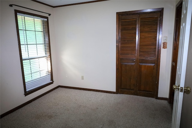 130 Golfcrest St, Rusk, TX 75785 - unfurnished bedroom featuring carpet, crown molding, and a closet