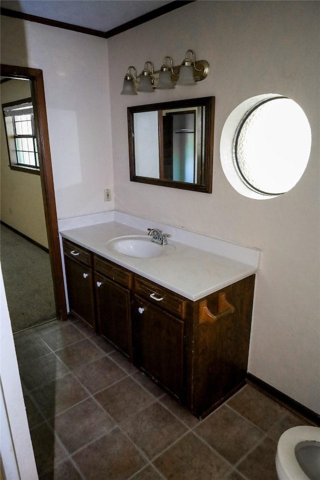 130 Golfcrest St, Rusk, TX 75785 - bathroom with vanity, ornamental molding, and tile patterned floors