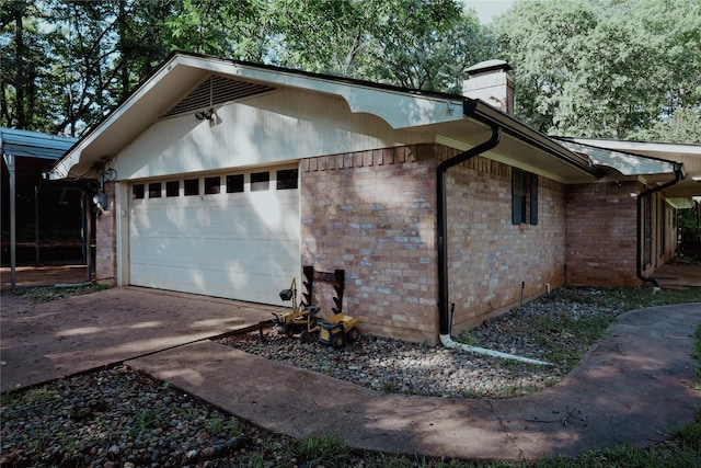 130 Golfcrest St, Rusk, TX 75785 - view of side of home featuring a chimney, brick siding, and concrete driveway